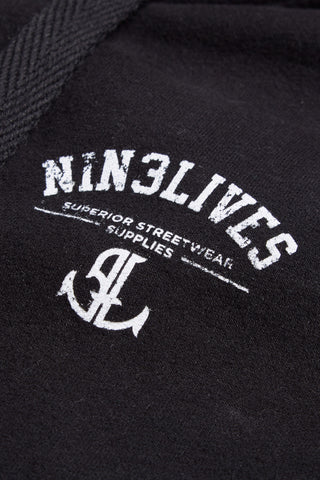 Plain black hoodie front logo detail