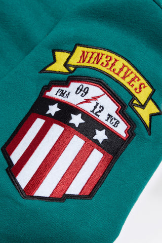 Green fire tales hoodie sleeve detail